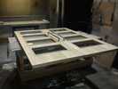 Pair of glazed maple veneered doors with ironmongery